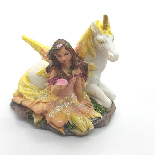 Fairy & Her Unicorn Holding A Flower