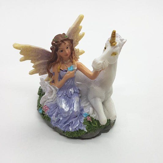 Fairy Stroking Her Unicorn