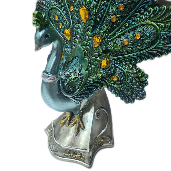 Blue Green Peacock on Silver Statue