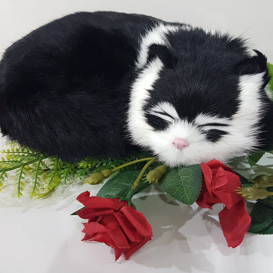 Black Lifelike Sleeping Cat Toy With White Stripe.