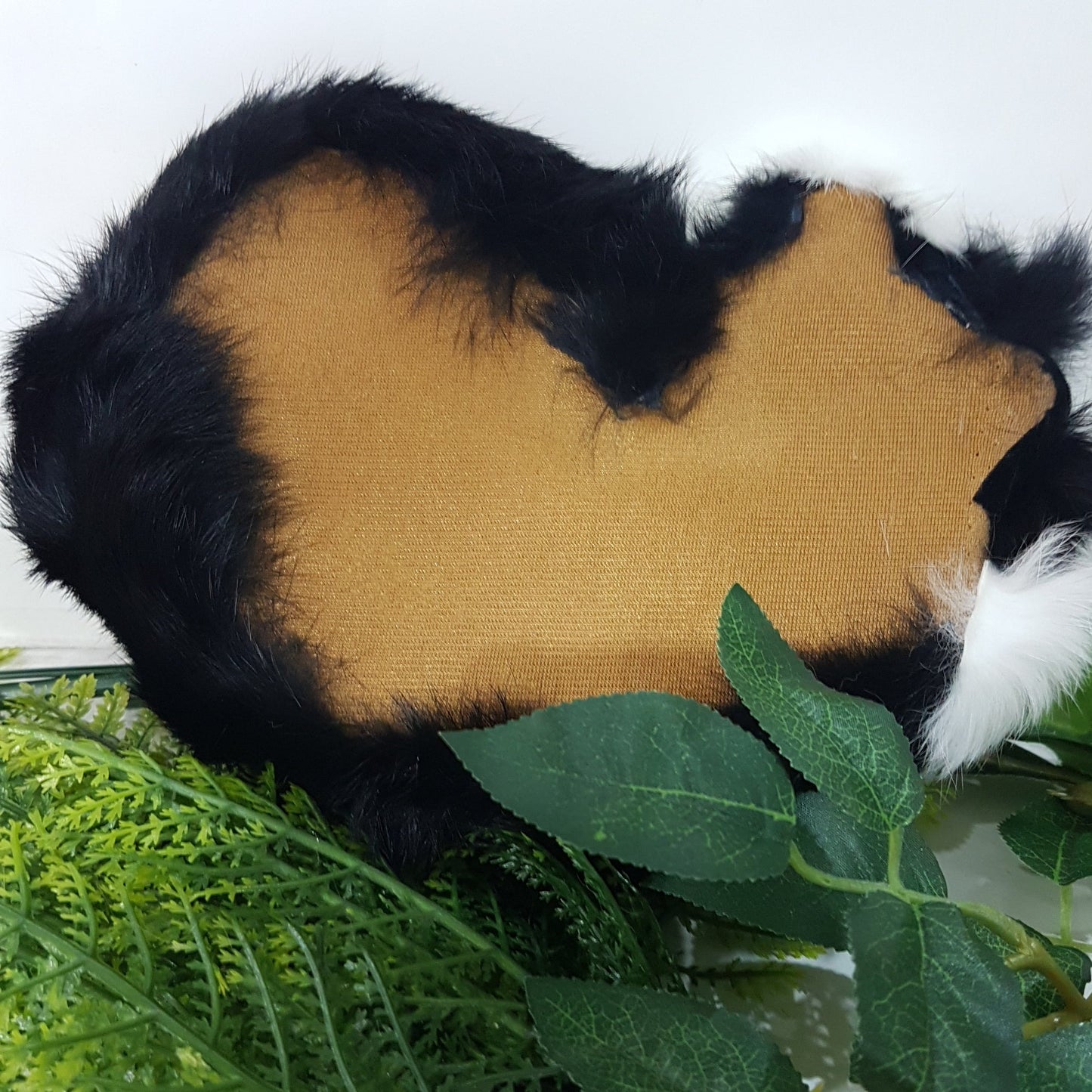 Black Lifelike Sleeping Cat Toy With White Stripe.