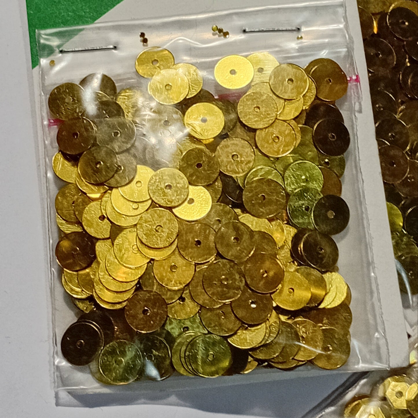 10 packs of Gold Sequins